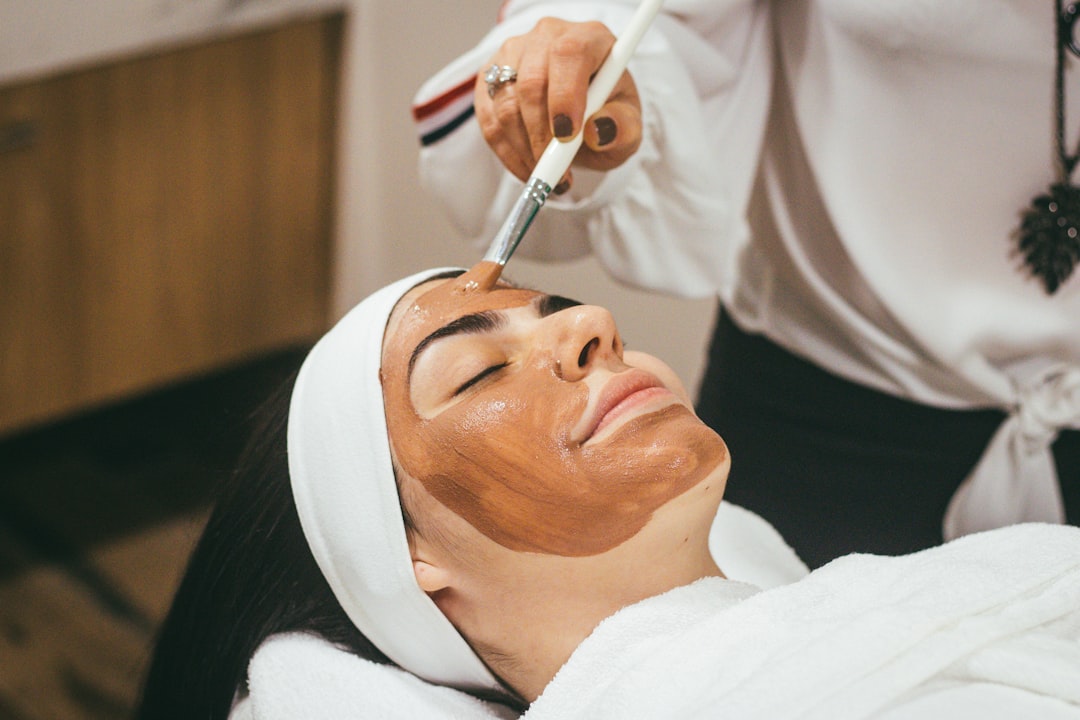 A serene home setting with natural skin care products like oils, masks, and a towel, emphasizing simplicity and self-care.