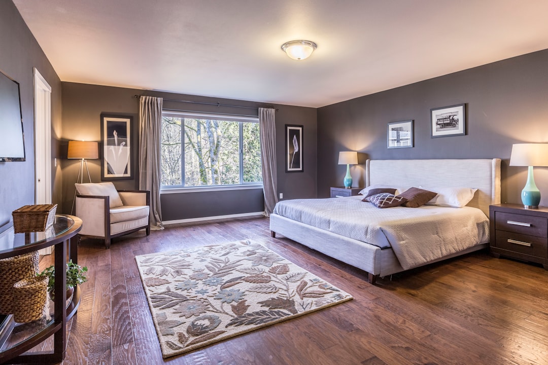 A serene and calming bedroom with soft lighting, neutral colors, and minimalistic decor, creating a peaceful atmosphere.