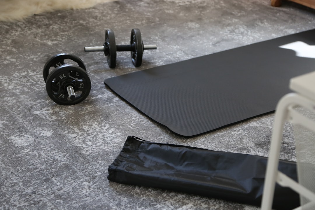 A person using simple fitness equipment at home to relieve lower back pain, demonstrating exercises that promote movement and strengthening.