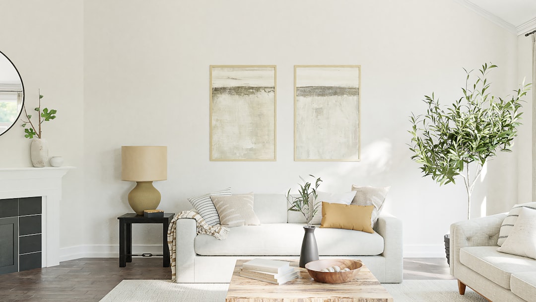A cozy living room with small decorative changes like new cushions, a stylish rug, and fresh plants.