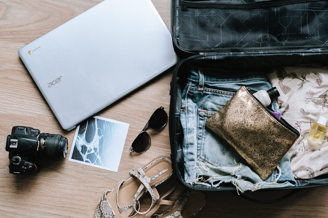 A neatly organized travel bag with compact items and travel essentials arranged for easy access.